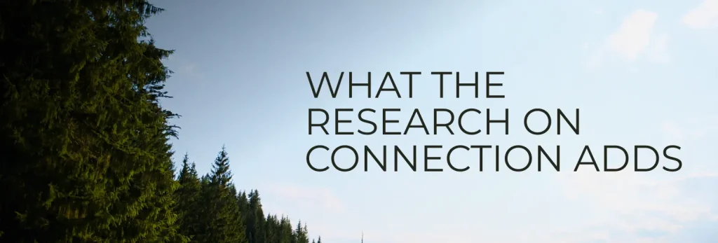 Text WHAT THE RESEARCH ON CONNECTION ADDS over a sky background with tall evergreen trees on the left, evoking themes of togetherness and relationships.