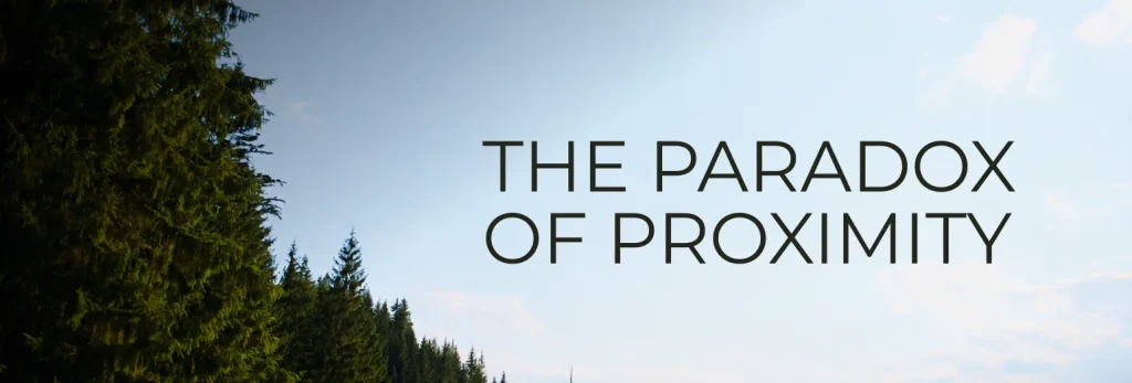 Tall green pine trees on the left under a blue sky with clouds evoke a sense of summer togetherness; large black text on the right reads THE PARADOX OF PROXIMITY, hinting at the complexities of relationships.